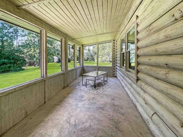 unfurnished sunroom featuring wooden ceiling