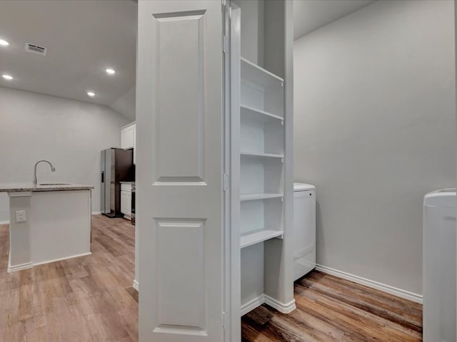 closet with a sink and visible vents