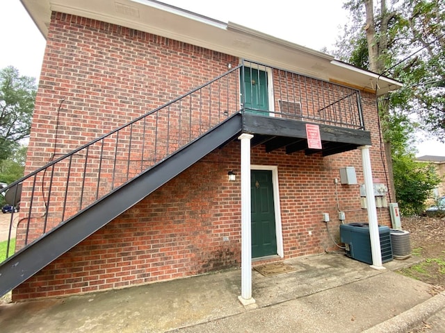 exterior space with a balcony and cooling unit