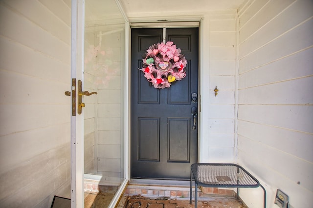 doorway to property with concrete block siding