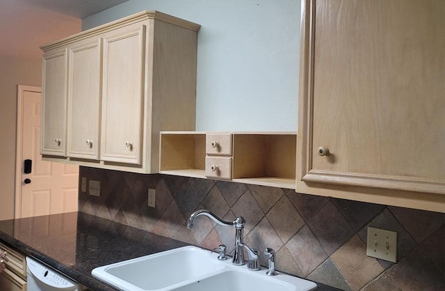 kitchen with dishwasher, tasteful backsplash, and a sink