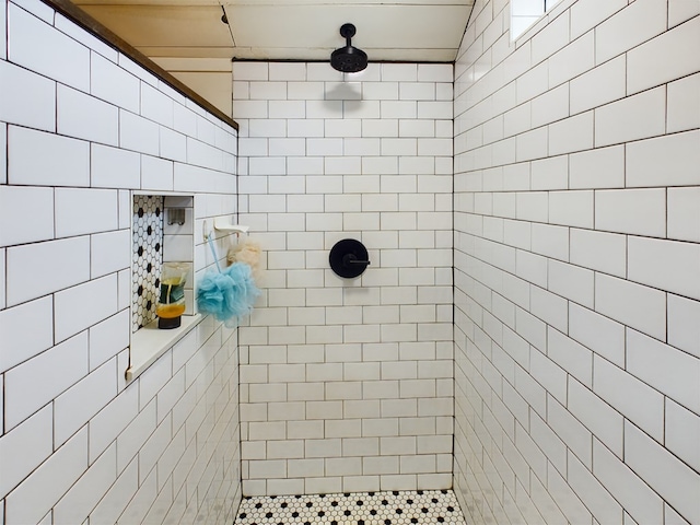 bathroom with tiled shower