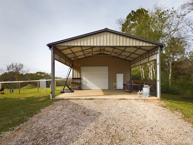 view of vehicle parking featuring a garage, a carport, and a lawn