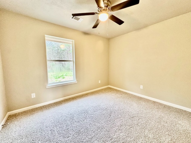 carpeted empty room with ceiling fan