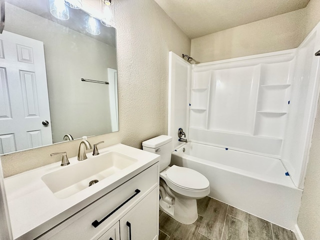 full bathroom with shower / bathing tub combination, vanity, and toilet