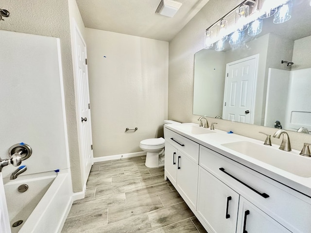 full bathroom with vanity, toilet, and tub / shower combination