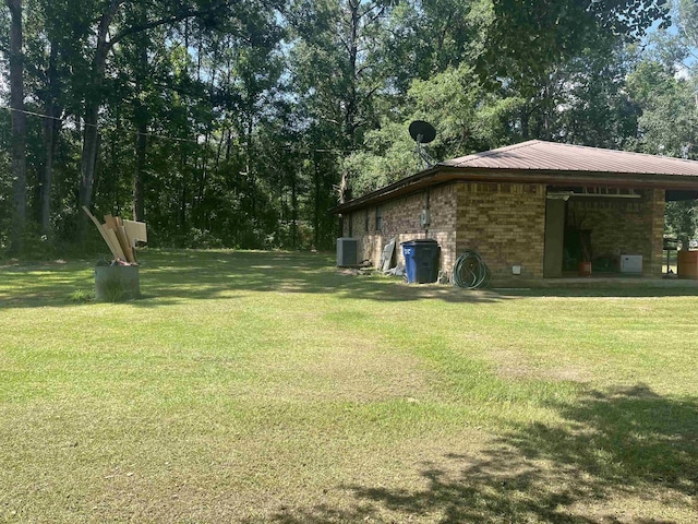 view of yard with central AC