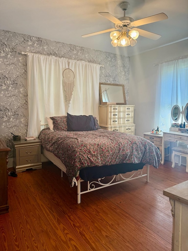 bedroom with wood finished floors and ceiling fan