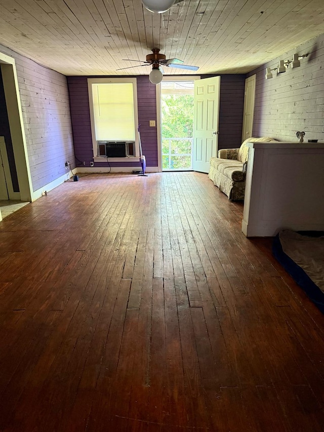 unfurnished living room featuring hardwood / wood-style flooring, ceiling fan, wood ceiling, and cooling unit