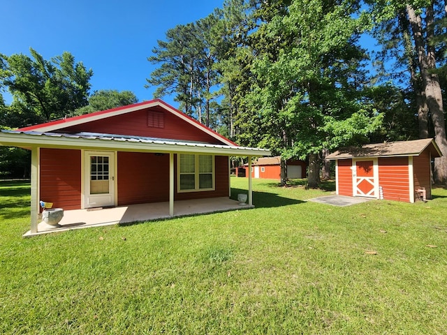 4710 County Road 082, Jasper, TX 75951 - rear view of house featuring a storage shed, a patio area, and a yard