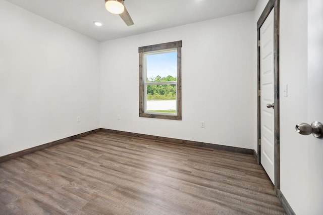 unfurnished bedroom with wood finished floors, baseboards, a ceiling fan, and recessed lighting