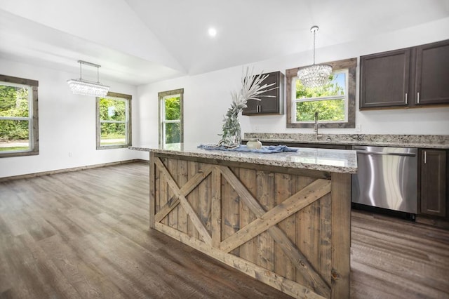 kitchen featuring stainless steel dishwasher, dark brown cabinetry, dark wood-type flooring, a chandelier, and lofted ceiling
