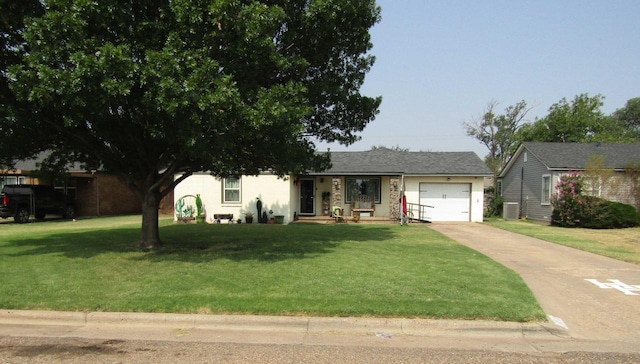 ranch-style home with central AC, a front yard, and a garage