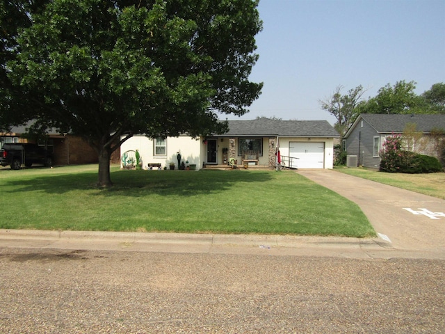 view of front of home featuring a garage and a front yard