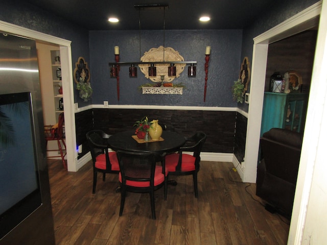 dining space featuring dark hardwood / wood-style flooring