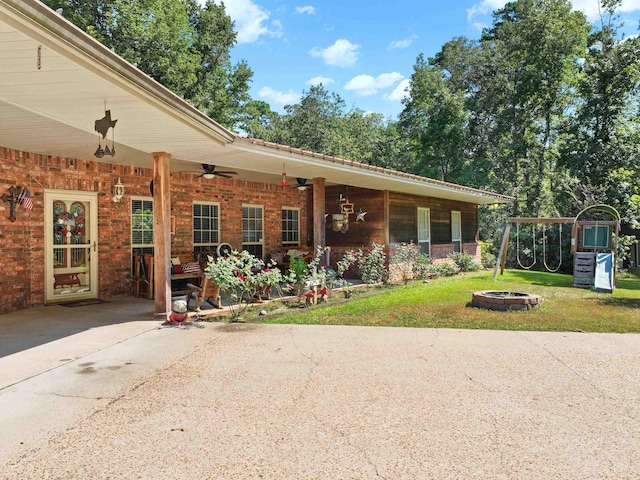 view of front of property featuring a playground and a front yard