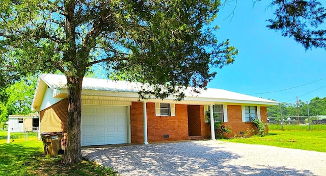 single story home with a garage and a front lawn