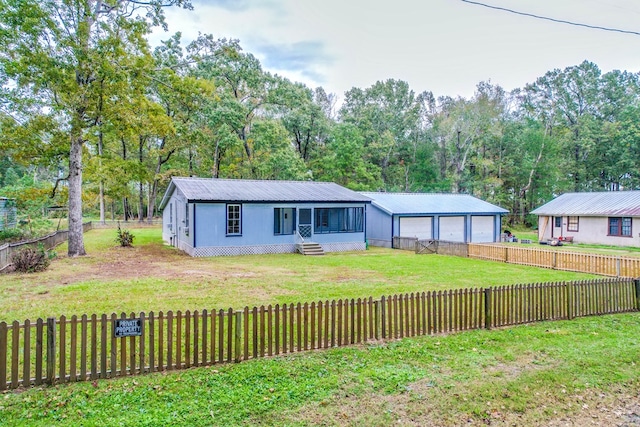 single story home with a garage and a front yard