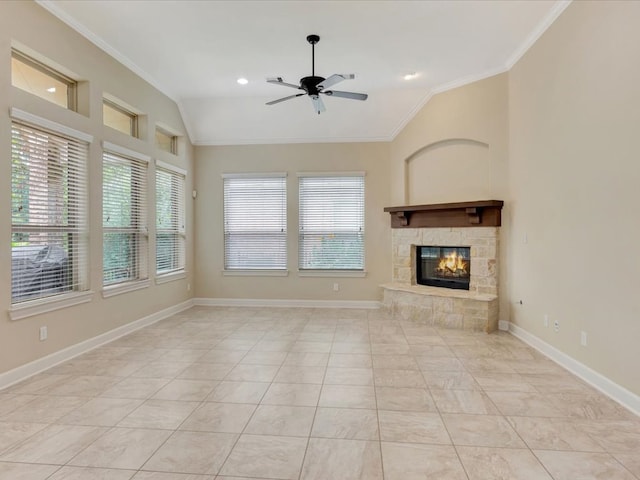 unfurnished living room featuring ceiling fan, a fireplace, lofted ceiling, and ornamental molding