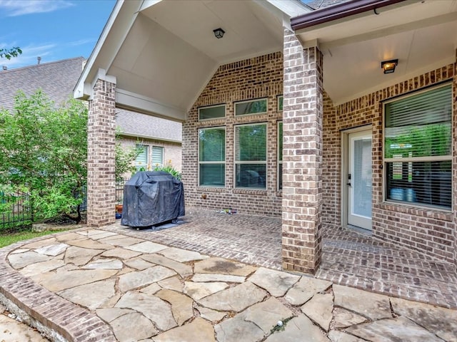 view of patio featuring a grill