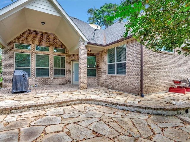 back of property featuring a patio area