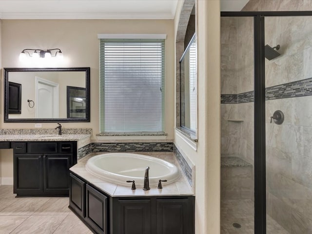 bathroom featuring tile patterned flooring, vanity, separate shower and tub, and crown molding