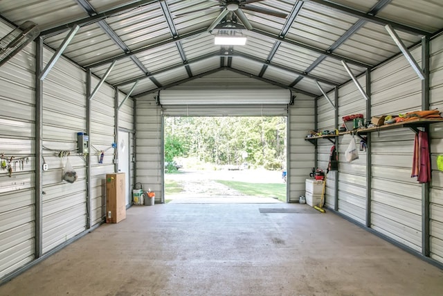 garage featuring wood walls