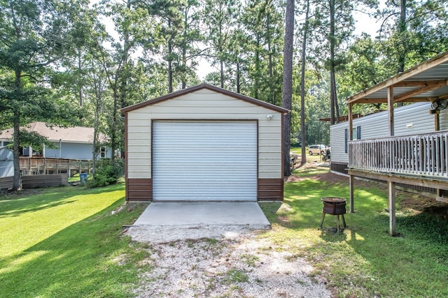 garage featuring a lawn