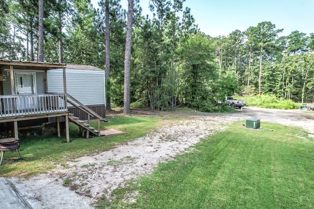 view of yard with a wooden deck