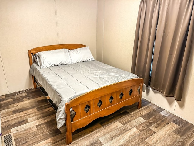 bedroom featuring wood-type flooring