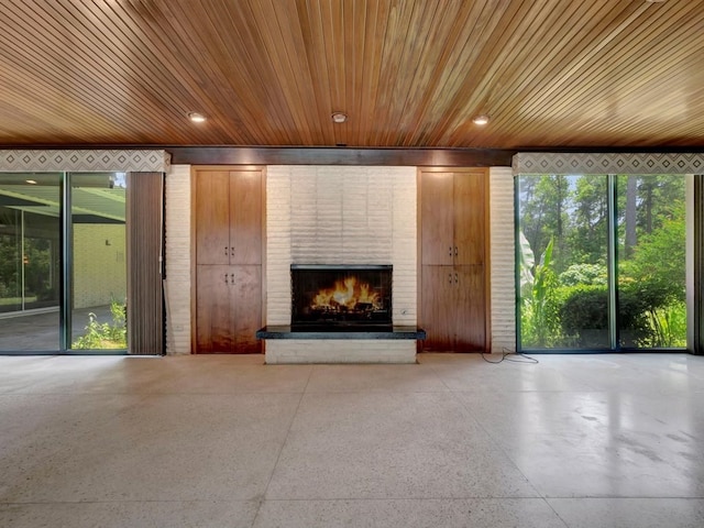1946 Southview Cir, Center, TX 75935 - unfurnished living room featuring wooden ceiling and a fireplace