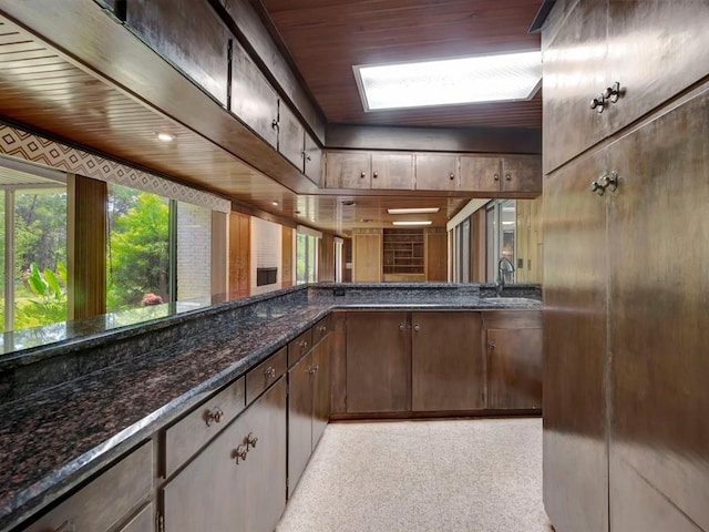 1946 Southview Cir, Center, TX 75935 - bar with a sink, dark speckled floor, and wood ceiling