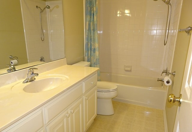 full bathroom featuring vanity, toilet, and shower / tub combo with curtain