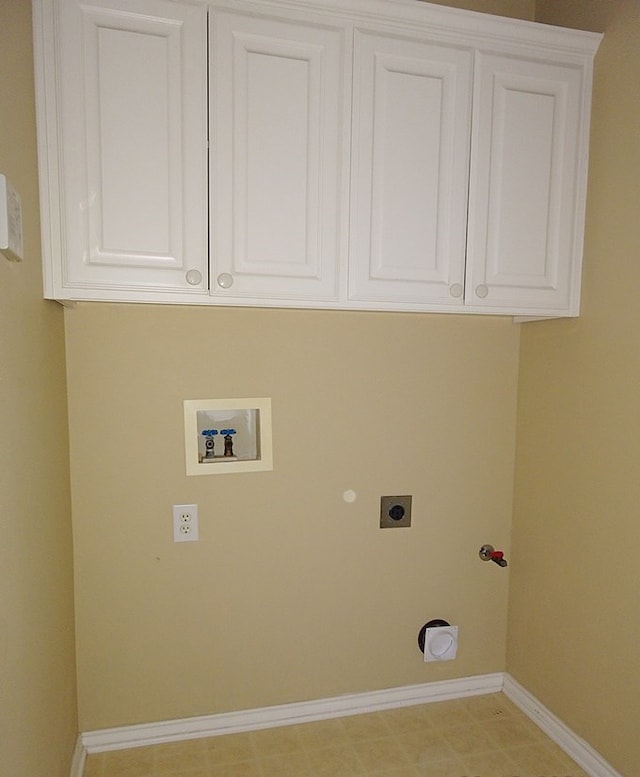 laundry area featuring hookup for an electric dryer, gas dryer hookup, cabinets, and hookup for a washing machine