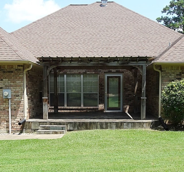 4805 Champions Dr, Lufkin, TX 75901 - rear view of property with roof with shingles, a yard, and brick siding