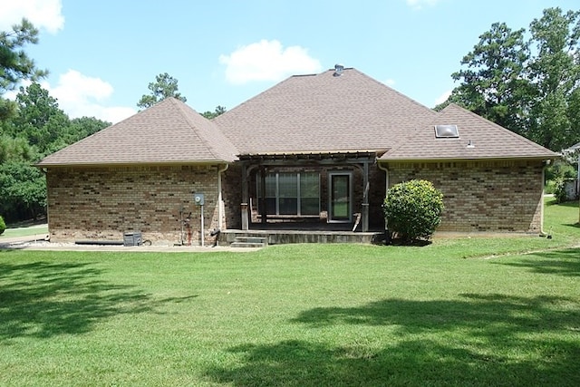 4805 Champions Dr, Lufkin, TX 75901 - back of house with brick siding, a yard, and roof with shingles
