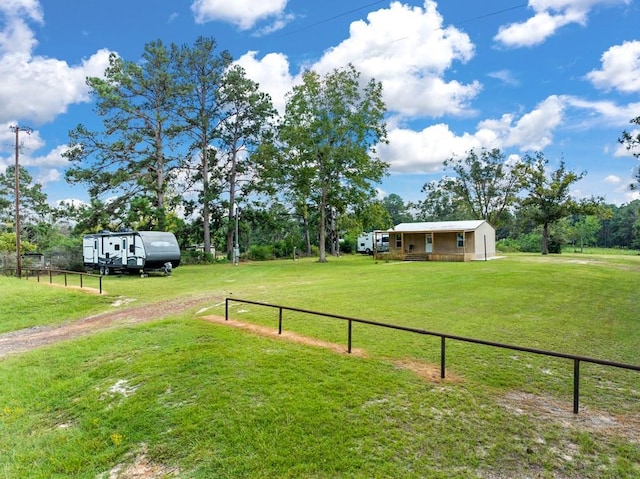 view of yard with a rural view