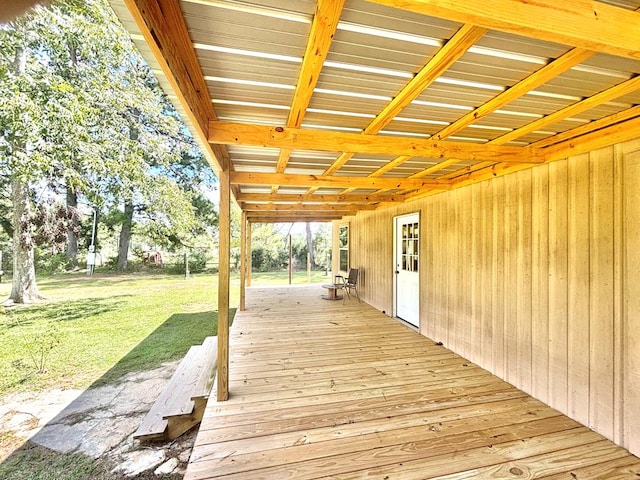 wooden deck featuring a lawn