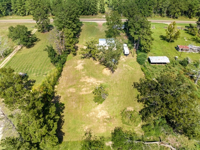 birds eye view of property with a rural view