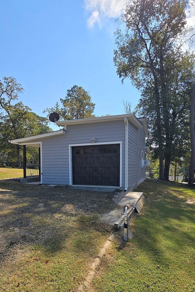 garage featuring a yard