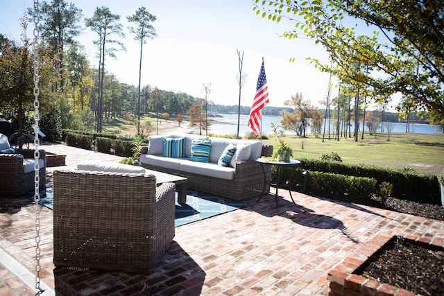 view of patio / terrace with an outdoor hangout area and a water view