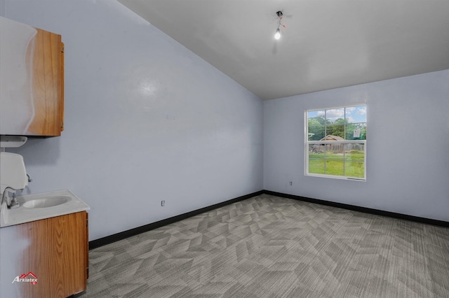 interior space with vaulted ceiling and sink