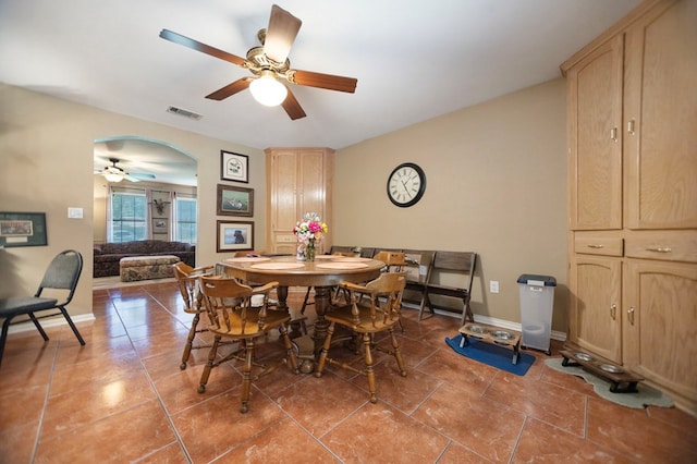 309 Echo Ln, Lufkin, TX 75904 - dining room featuring ceiling fan, light tile patterned floors, and arched walkways