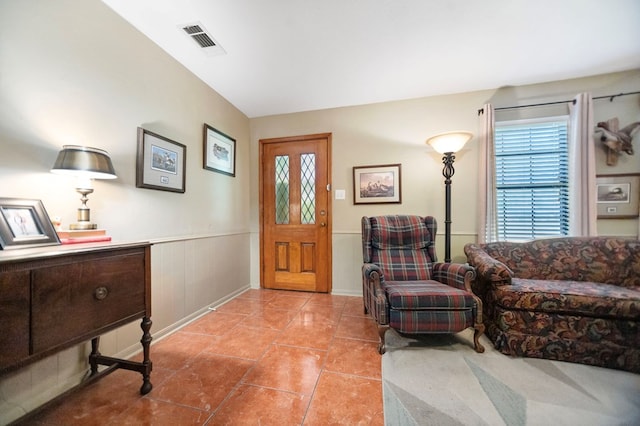 309 Echo Ln, Lufkin, TX 75904 - foyer with plenty of natural light, a wainscoted wall, and light tile patterned floors
