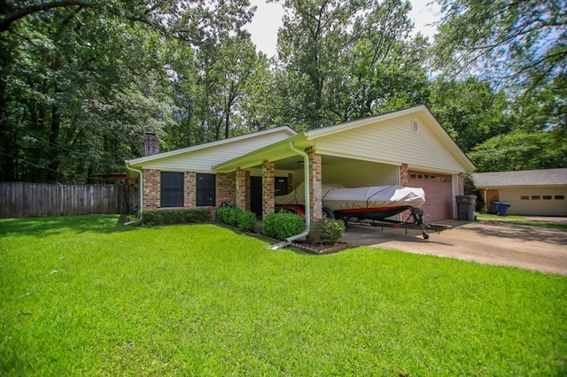 309 Echo Ln, Lufkin, TX 75904 - view of front of house with driveway, a garage, a chimney, and brick siding