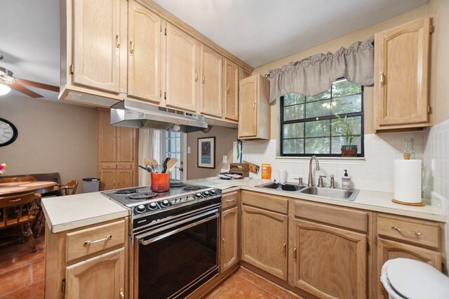 309 Echo Ln, Lufkin, TX 75904 - kitchen featuring under cabinet range hood, stainless steel electric range oven, light countertops, backsplash, and a peninsula