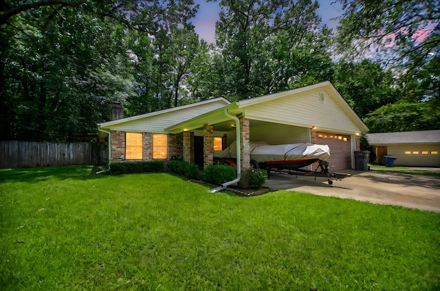 309 Echo Ln, Lufkin, TX 75904 - view of front of home with an attached garage, concrete driveway, a chimney, stone siding, and covered porch