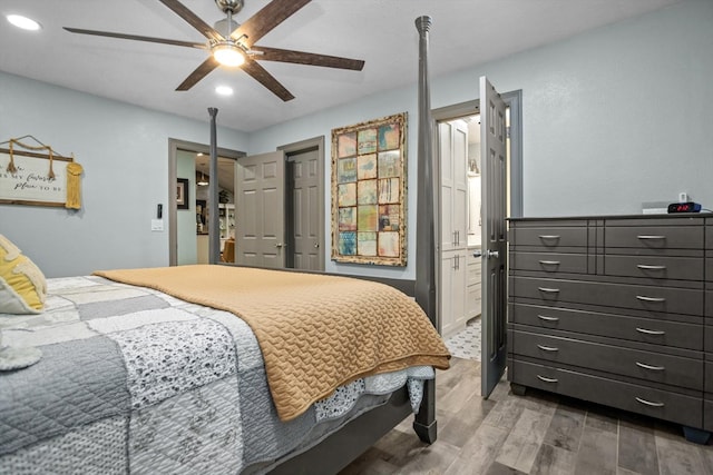 bedroom featuring wood-type flooring and ceiling fan