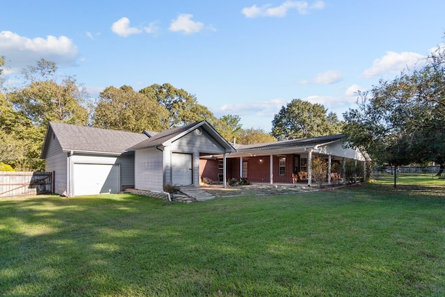 view of front facade with a garage and a front lawn