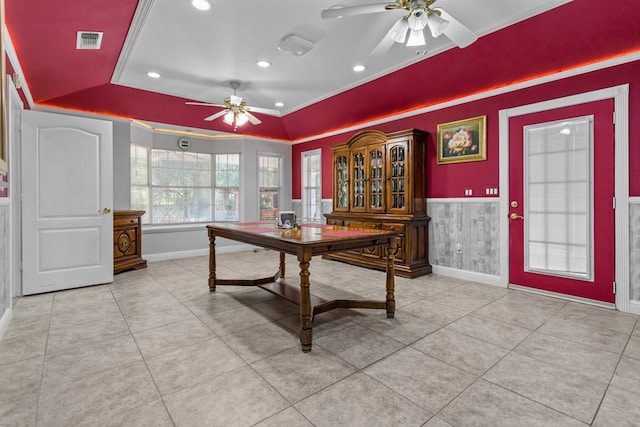 office featuring a raised ceiling, crown molding, ceiling fan, and light tile patterned floors